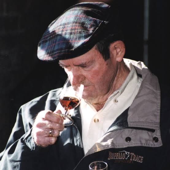 Elmer T. Lee nosing a glass of bourbon